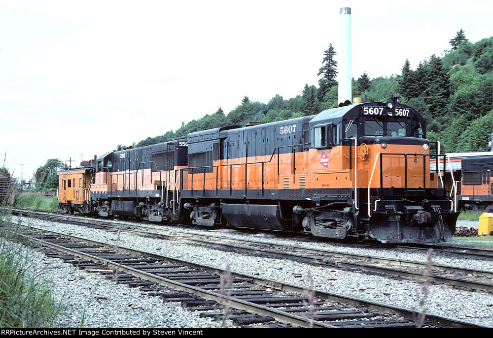 Milwaukee Road U30B #5607 & U28B #5503 with caboose. U23B #5003 in background.